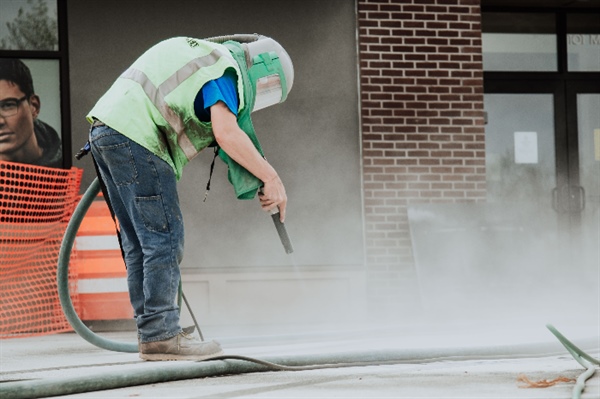 How Media Blasting Improves the Longevity of Outdoor Surfaces